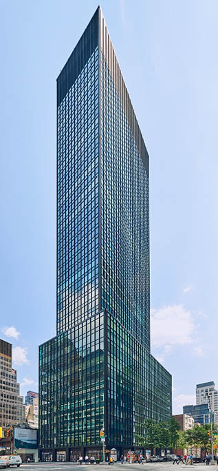 A tall building with many windows. Description generated by AI